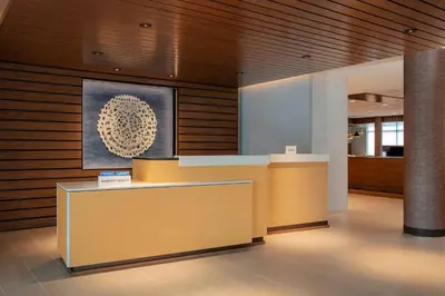 a lobby with a reception desk in a building at Fairfield by Marriott Inn & Suites Lewisburg in Lewisburg