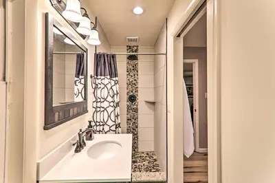 a bathroom with a sink and a mirror at Sunroom, Fire Pit and Sauna Lake Locust Village Gem in Pocono Lake
