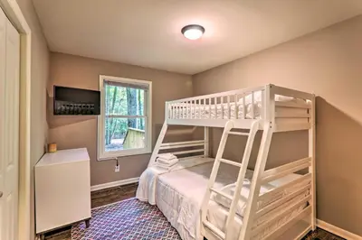 a bedroom with a bunk bed and a ladder at Sunroom, Fire Pit and Sauna Lake Locust Village Gem in Pocono Lake