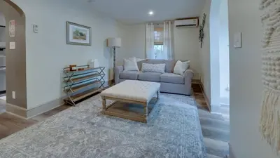 a living room with a couch and a table at The Suite in a historic carriage house in Kennett Square
