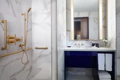 a bathroom with a sink and a shower at Hard Rock Hotel New York in New York