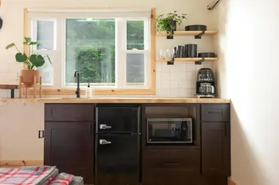 a kitchen with a sink and a microwave at The Rex in Greentown
