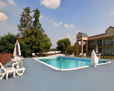 a swimming pool with chairs and a hotel at Quality Inn & Suites York East in York