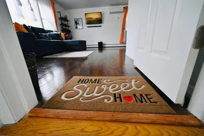 a welcome mat in theoyer of a home sweet home at Bright & cozy * 2nd Floor Apartment*. Close to NYC in Bloomfield