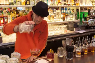 a man standing at a bar making a drink at The Standard - East Village in New York