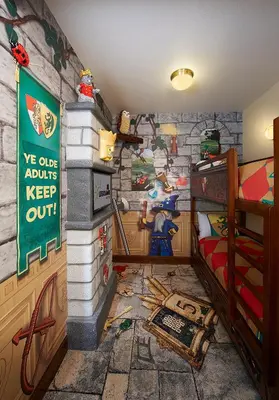 a childrens bedroom with a castle themed wall at LEGOLAND New York Resort in Goshen