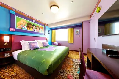 a hotel room with a large bed and a desk at LEGOLAND New York Resort in Goshen