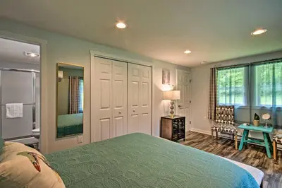 a bedroom with a bed and a desk and a window at 15 Mi to Camelback Resort! The Overlook Home in Brodheadsville