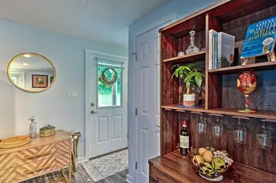 a room with a table and a shelf with wine bottles at 15 Mi to Camelback Resort! The Overlook Home in Brodheadsville
