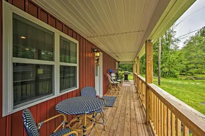 a deck with chairs and tables on a house at 15 Mi to Camelback Resort! The Overlook Home in Brodheadsville