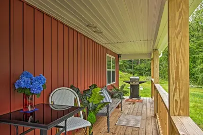 a porch with a table and chairs and a grill at 15 Mi to Camelback Resort! The Overlook Home in Brodheadsville