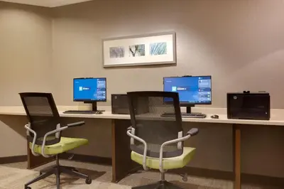 an office with two desks with two monitors and two chairs at SpringHill Suites by Marriott Newark International Airport in Newark