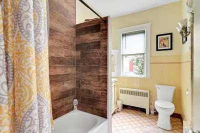 a bathroom with a tub and a toilet and a shower at Mountain View Victorian with Convenient Location and Lots of Space tp Play farmhouse in Napanoch