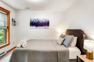 a bedroom with a bed and a window at Northridge 363 in Tannersville