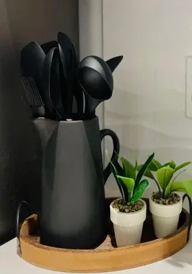 a black container with utensils and plants on a table at Scandi Lakefront Condo Near Big Boulder Ski! in Lake Harmony