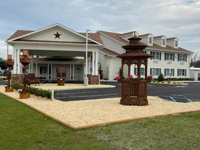 a large building with a gazebo in front of it at Country Inn of Hazlet in Hazlet