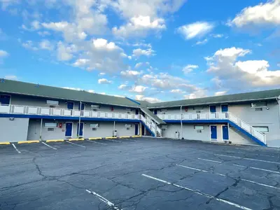 an empty parking lot in front of a building at Crown Inn in Linden