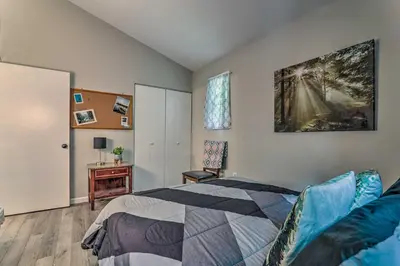 a bedroom with a bed and a desk at Fire Pit and Community Perks Blakeslee Cottage! in Blakeslee