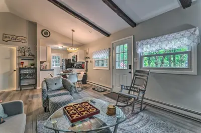 a living room with a table and chairs at Fire Pit and Community Perks Blakeslee Cottage! in Blakeslee