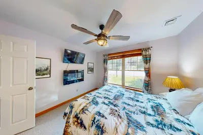 a bedroom with a bed and a ceiling fan at Northridge 372 in Tannersville