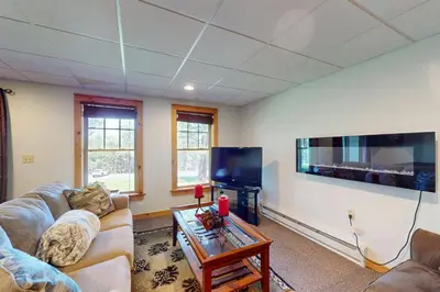 a living room with couches and a flat screen tv at Northridge 372 in Tannersville