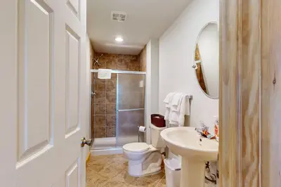 a bathroom with a toilet and a sink and a shower at Northridge 372 in Tannersville