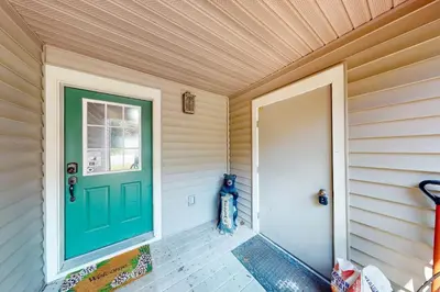 a green door on the side of a house at Northridge 372 in Tannersville