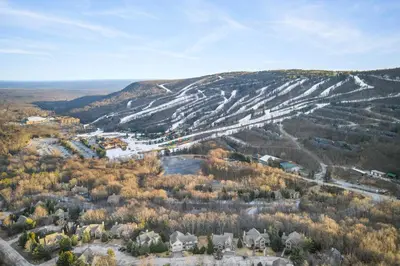an aerial view of a mountain with houses and trees at Northridge 372 in Tannersville