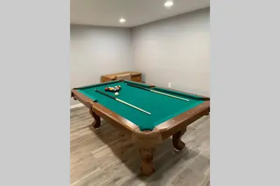 a pool table in a gaming room with afits at Just renovated Camelback SKI-ON/OFF,SNOW TUBING,PAINTBALL in Tannersville