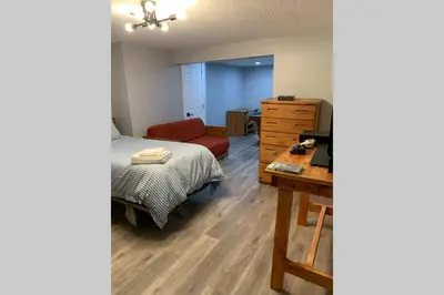 a bedroom with a bed and a desk and a dresser at Just renovated Camelback SKI-ON/OFF,SNOW TUBING,PAINTBALL in Tannersville