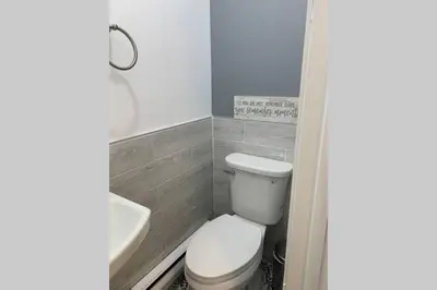 a bathroom with a toilet and a sink at Just renovated Camelback SKI-ON/OFF,SNOW TUBING,PAINTBALL in Tannersville