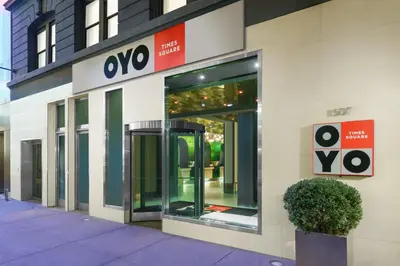 a store front with an open door on a building at OYO Times Square in New York