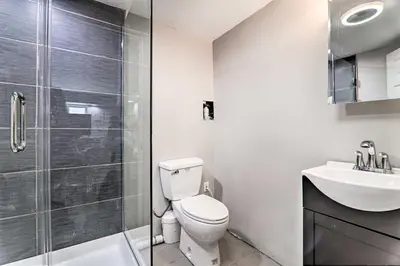 a bathroom with a toilet and a shower and a sink at Game Room! Poconos Paradise 10 Mi to Ski Slopes in East Stroudsburg