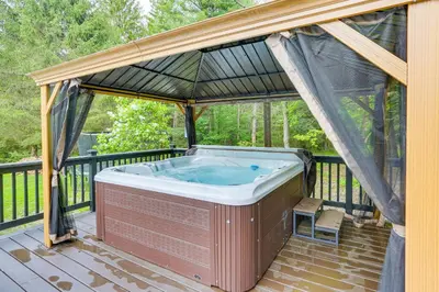 a hot tub in a gazebo on a deck at Game Room and Yard Greentown Home Near State Park in Greentown