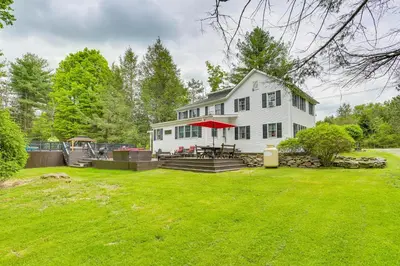 a white house with a picnic table in the yard at Game Room and Yard Greentown Home Near State Park in Greentown