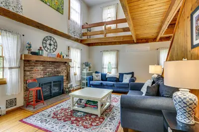 a living room with a couch and a fireplace at Game Room and Yard Greentown Home Near State Park in Greentown