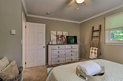 a bedroom with a bed and a dresser and a window at Deck and Gas Grill Modern East Stroudsburg Home! in East Stroudsburg