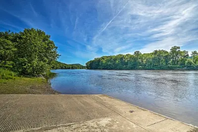 a view of a river with trees in the background at Deck and Gas Grill Modern East Stroudsburg Home! in East Stroudsburg