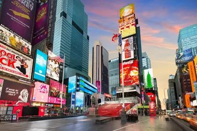 a city street with many tall buildings and signs at Hyatt Regency Times Square in New York