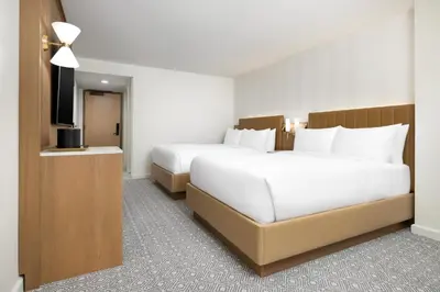 a hotel room with two beds and a flat screen tv at Hyatt Regency Times Square in New York