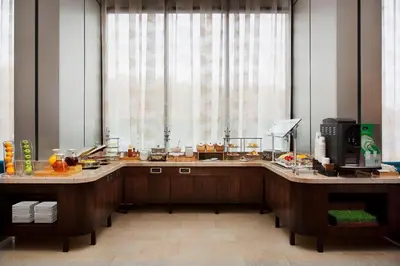 a kitchen with two counters and a large window at Teaneck Marriott at Glenpointe in Teaneck