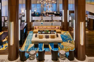 a lobby with a couch and a table in a room at Teaneck Marriott at Glenpointe in Teaneck