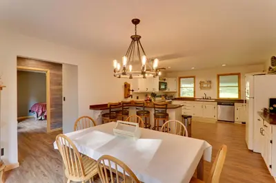 a kitchen and dining room with a table and chairs at 2 Mi to Elk Mountain Poconos Escape on 11 Acres! in Pleasant Mount