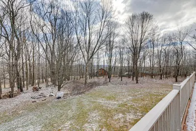 a yard with trees and a white fence at 2 Mi to Elk Mountain Poconos Escape on 11 Acres! in Pleasant Mount