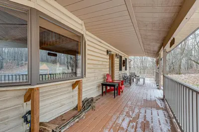 an empty porch of a house with windows at 2 Mi to Elk Mountain Poconos Escape on 11 Acres! in Pleasant Mount