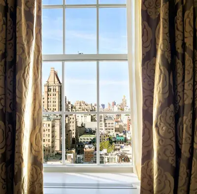 a window with a view of the city at The Pierre, A Taj Hotel, New York in New York