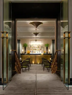 a view of a restaurant with chairs and a bar at The Pierre, A Taj Hotel, New York in New York