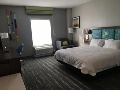 a hotel room with a bed and a window at Hampton Inn Old Bridge NJ in Old Bridge
