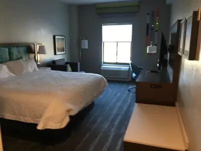a hotel room with a bed and a window at Hampton Inn Old Bridge NJ in Old Bridge