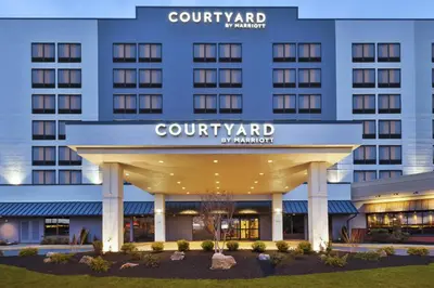 a rendering of the front of a court yard hotel at Courtyard by Marriott Secaucus Meadowlands in Secaucus